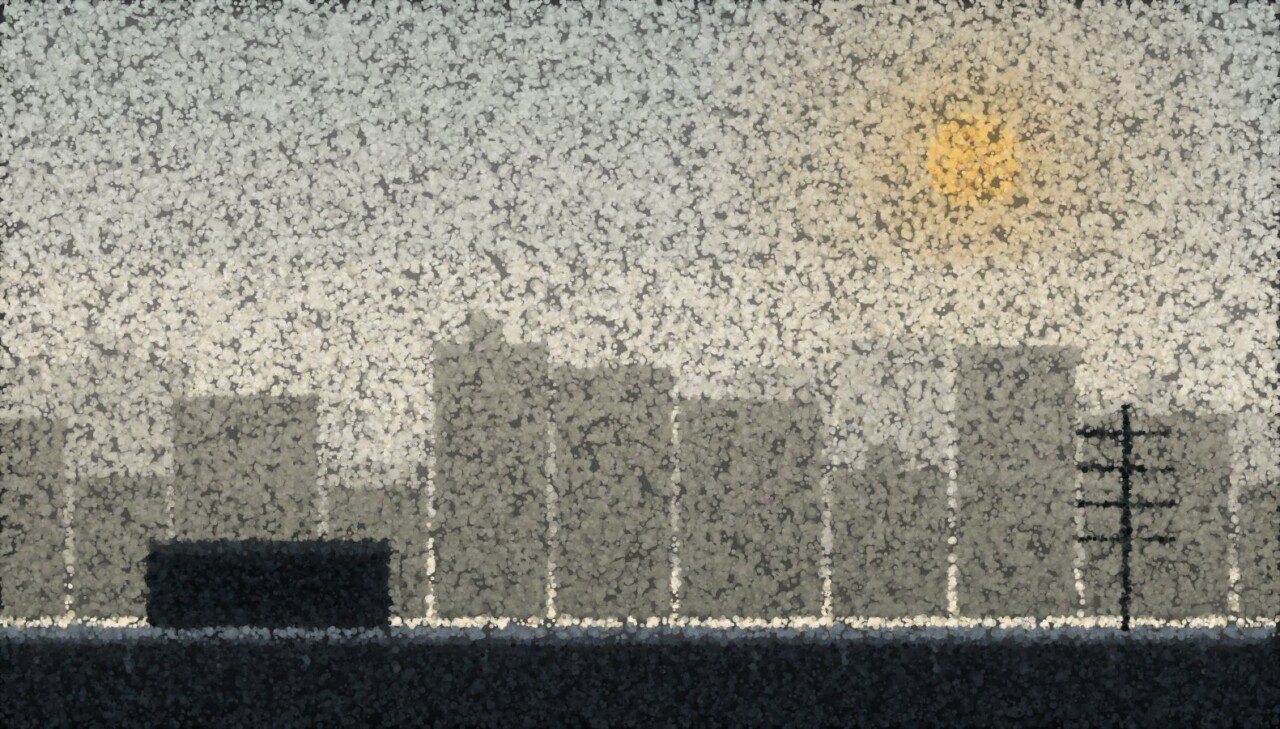 A city skyline in daytime haze, the far towers fading pale while a near rooftop parapet stands dark.