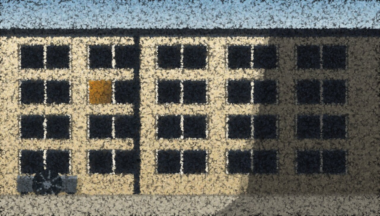 A sunlit apartment facade cut in half by hard shadow, its windows shut, with a single air-conditioning unit under one of them.