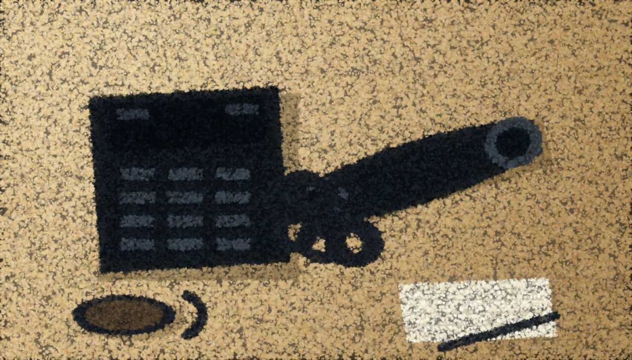 A telephone seen from above on a table with the handset lying beside it, next to a mug and a notepad.