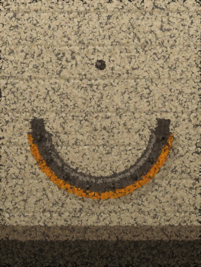 A pointillist plank wall with a large rusted iron horseshoe nailed above a doorway, its nail holes visible along the band.