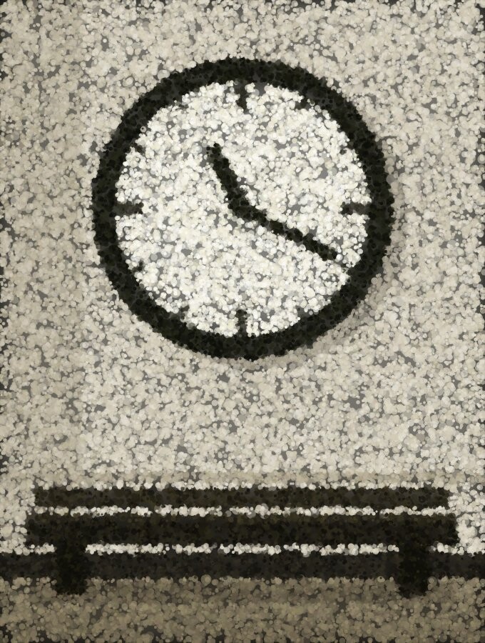 A plain clock on a bright corridor wall with an empty dark bench beneath it.