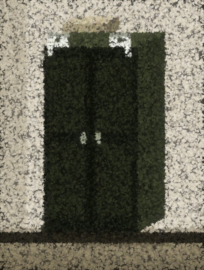 A tall dark wardrobe against a light wall, fixed at the top by two bright metal brackets, with a box left on top.