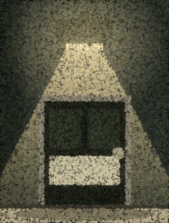 A security light above a door throwing a bright cone down over the entrance and the ground in front of it.