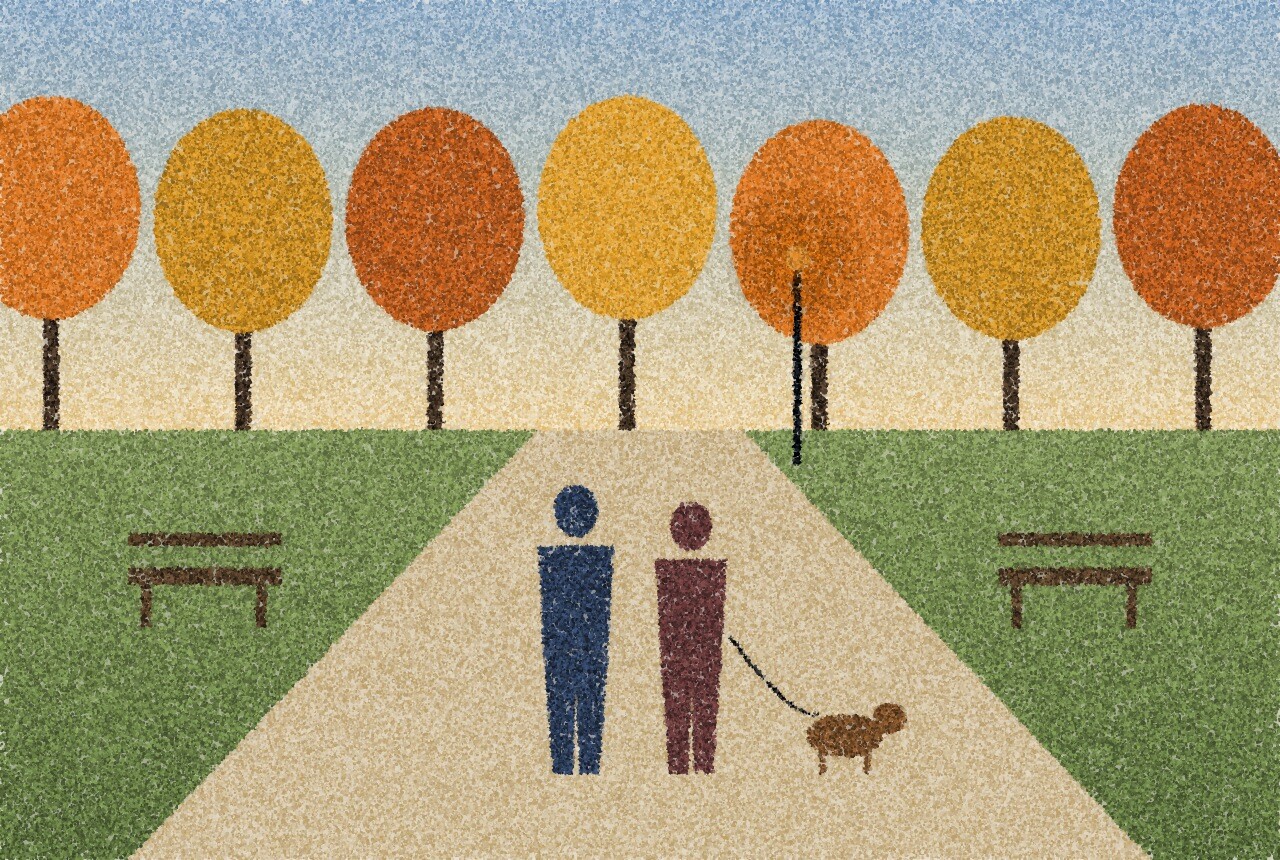 A pointillist illustration: two people walking a dog along a quiet park path in autumn, benches and trees on either side, one amber streetlamp ahead.