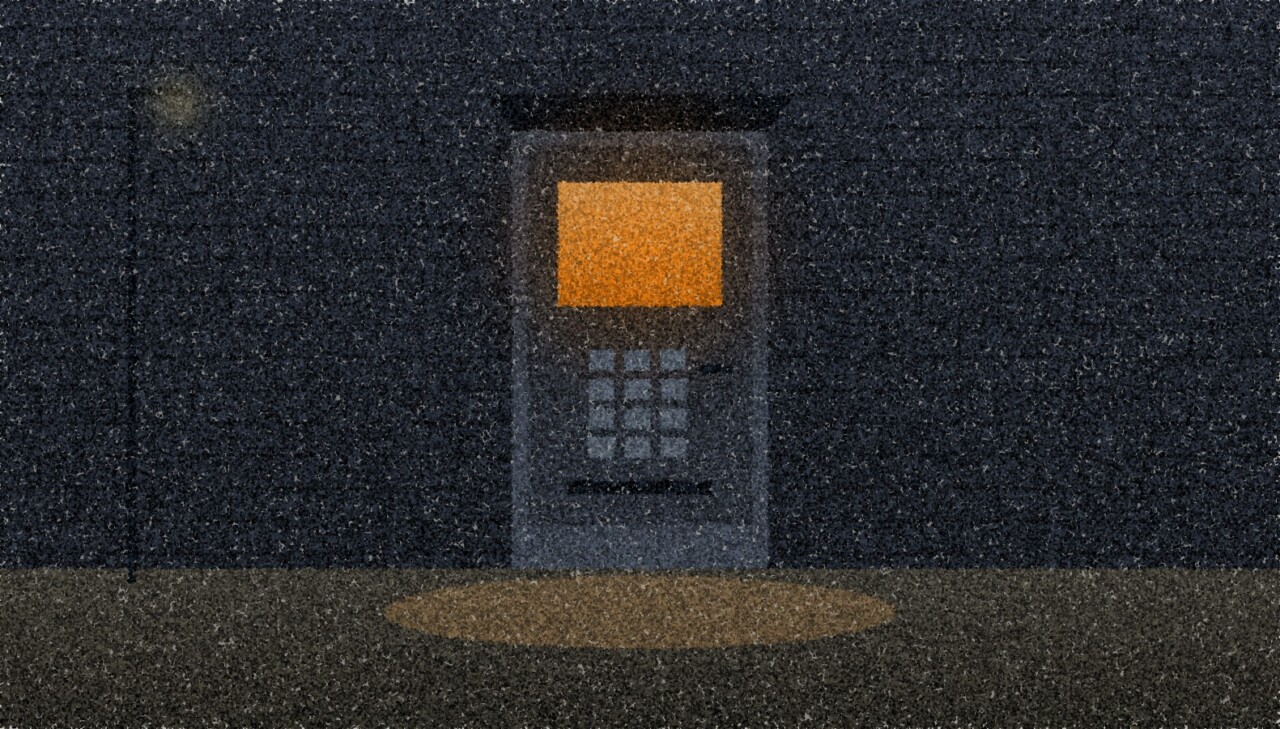 A pointillist illustration: a cash machine set into a dark brick wall at night, its screen glowing amber above an empty pavement.