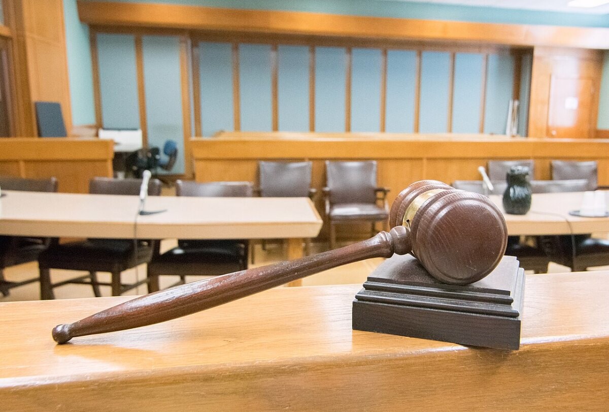 A gavel on a courtroom bench