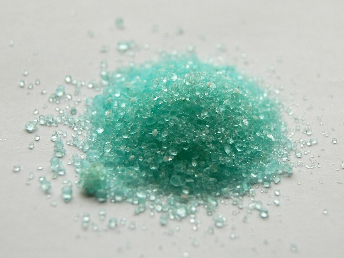 Crystals of iron(II) sulfate heptahydrate, a compound used in iron supplements