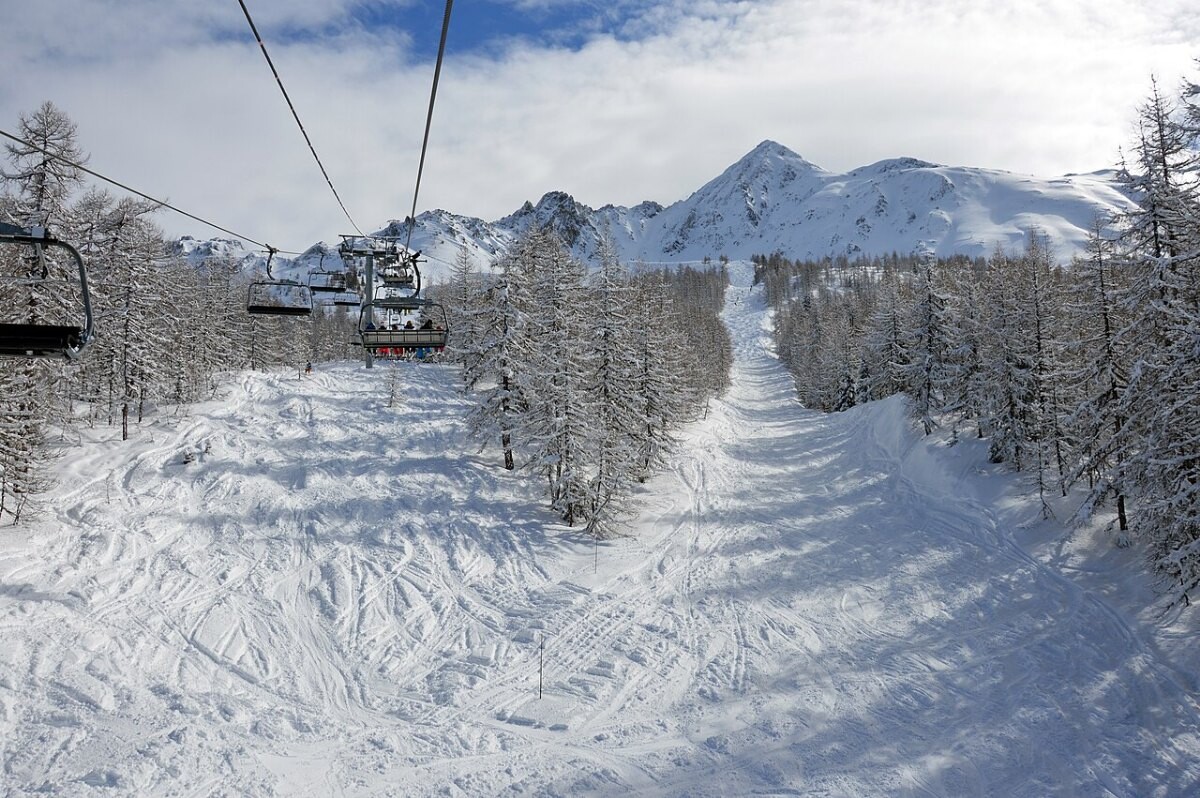 A ski lift above a snowy slope