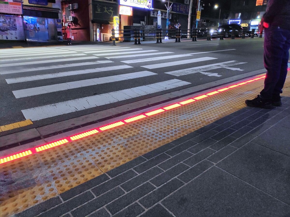 A pedestrian crossing with embedded lights
