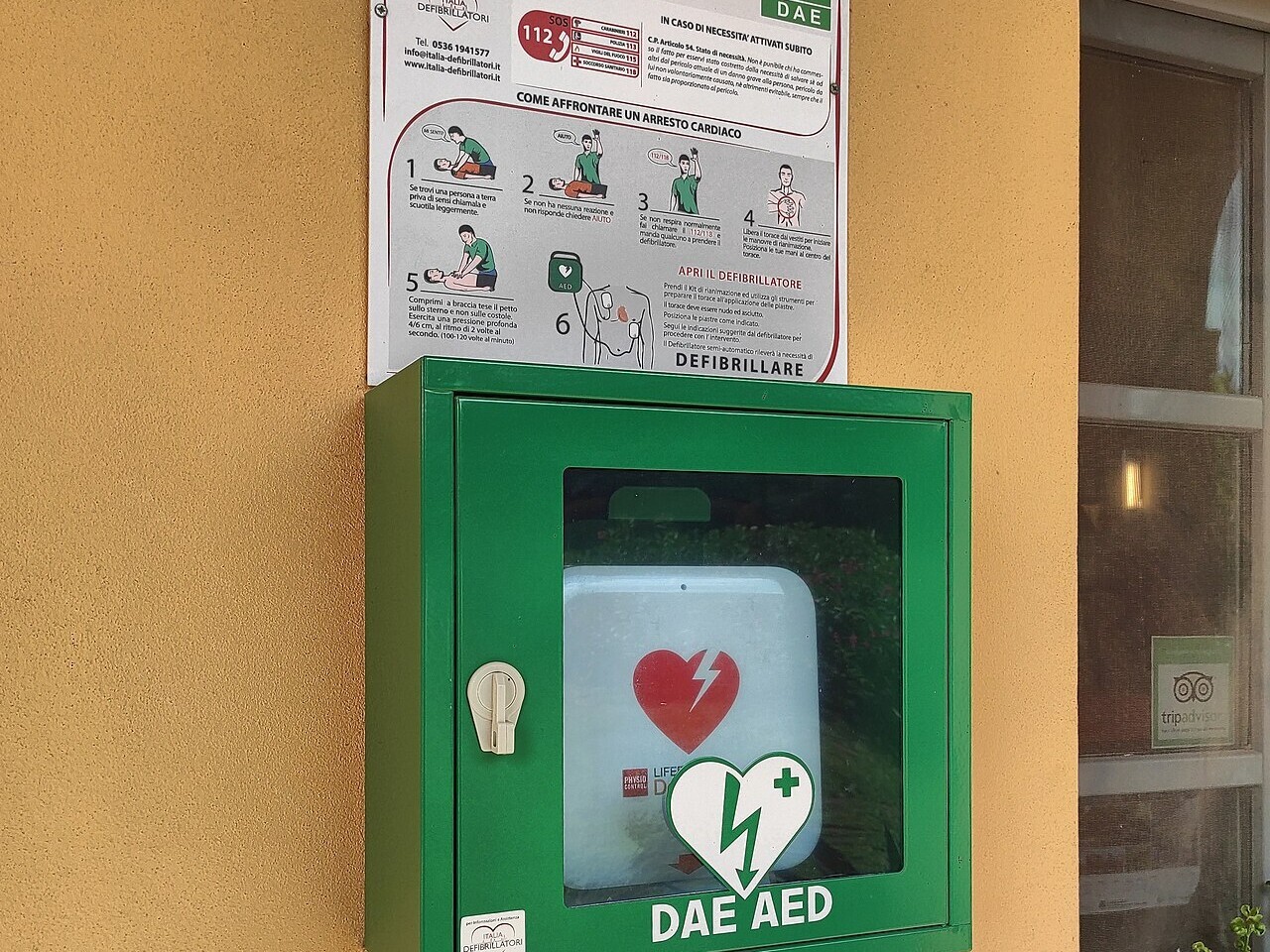 A public automated external defibrillator in a wall cabinet