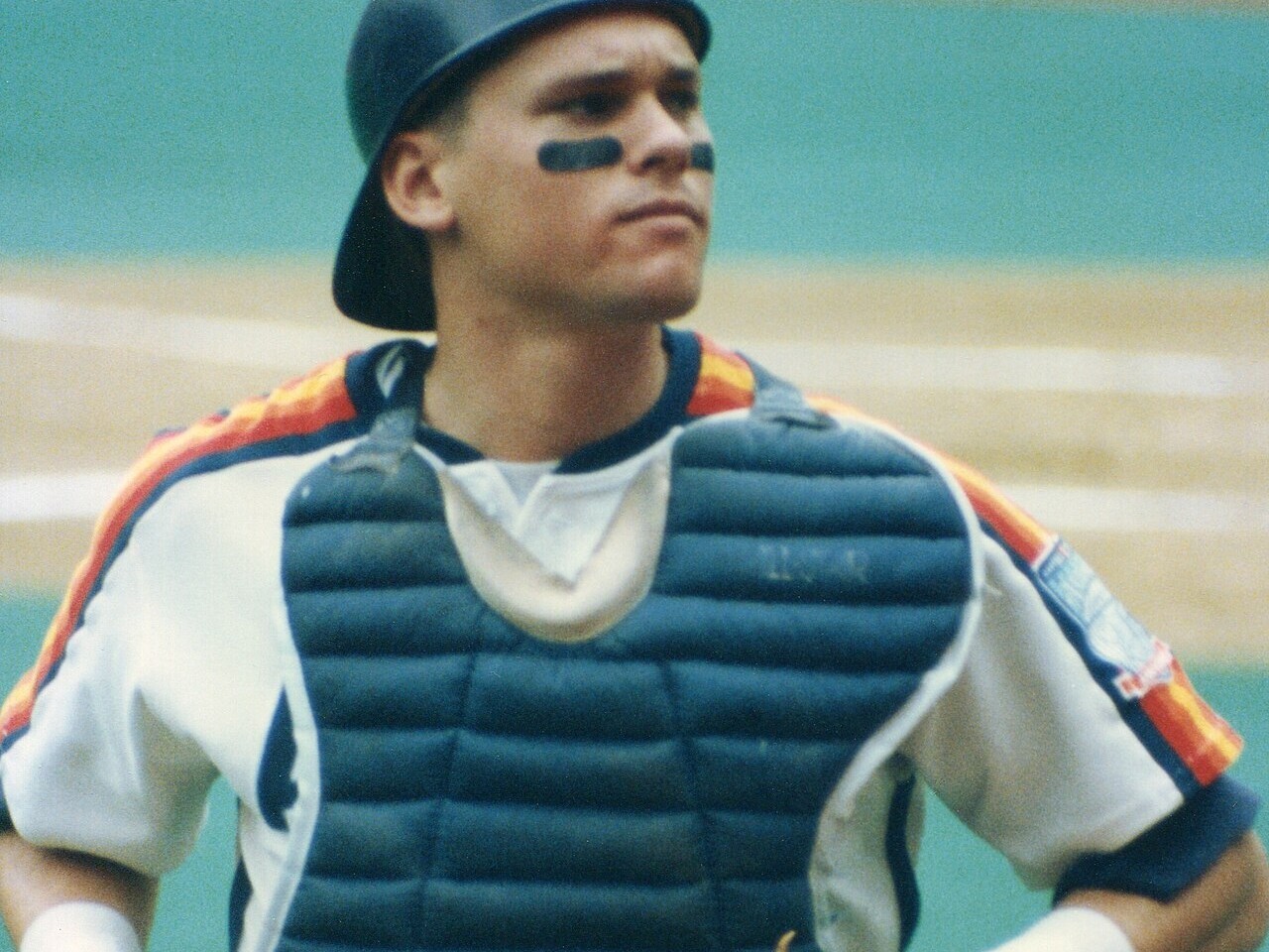 A catcher in mask and chest protector during a Major League game
