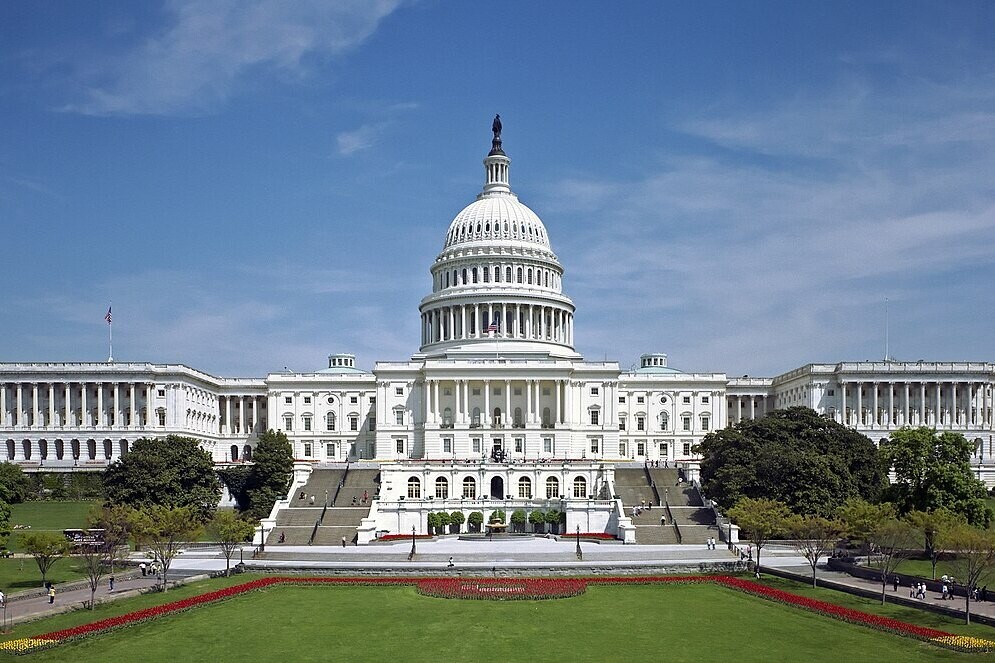 The west front of the United States Capitol under a blue sky