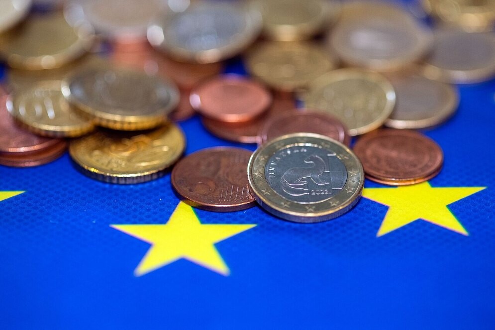 File photo: euro coins on a European Union flag
