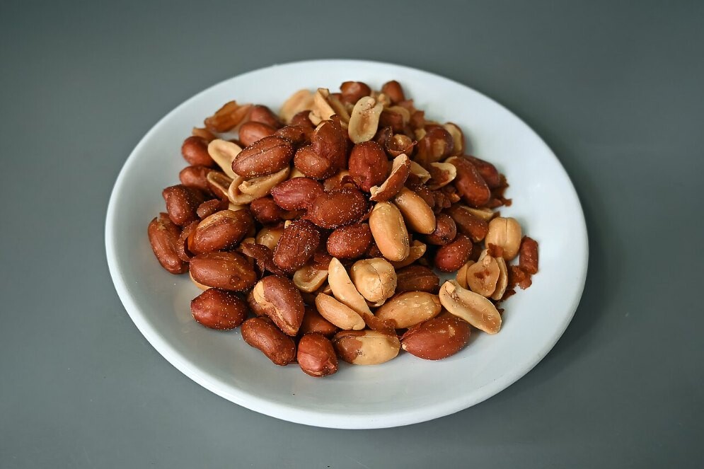 Roasted peanuts on a white plate