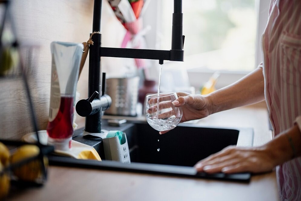 File photo of a glass being filled at a kitchen tap