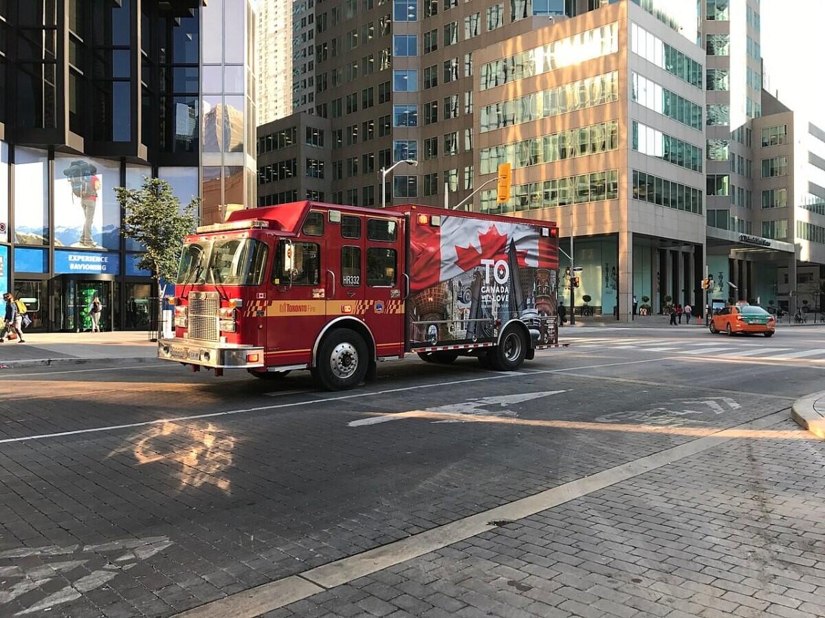 A Toronto Fire Services high-rise unit truck on a city street