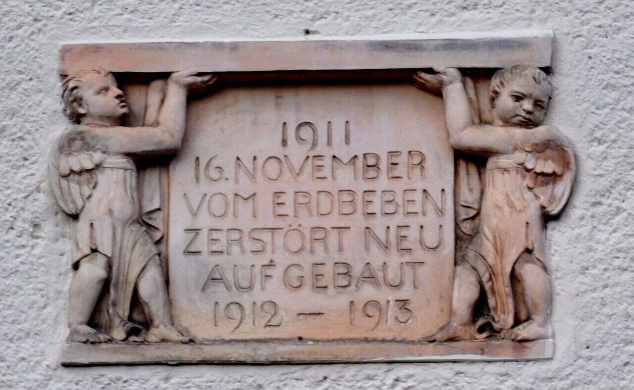 Plaque about an earthquake on a church in Albstadt-Lautlingen