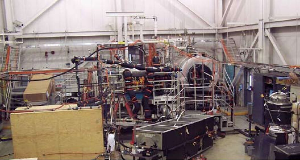 Pipes, pumps and tanks of a fuel-system test rig in a hangar