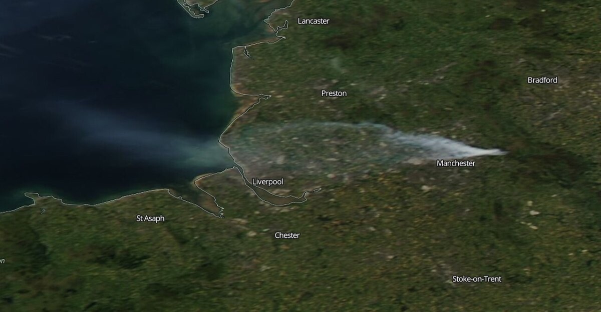 Satellite image of a smoke plume drifting west from moorland near Manchester