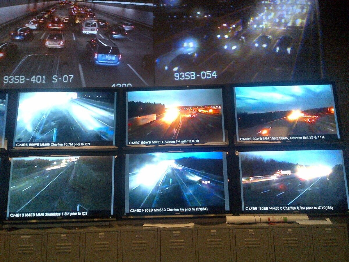 A traffic operations centre with a wall of live highway camera feeds